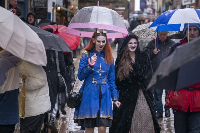 The rainy weather didn’t put them off from attending as they shielded themselves with umbrellas.