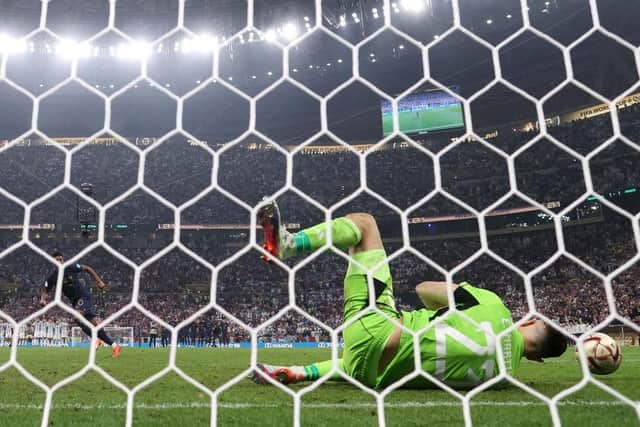 KEY MOMENT: Argentina's Emiliano Martinez saves from Kingsley Coman in the penalty shoot-out to decide the 2022 World Cup final
