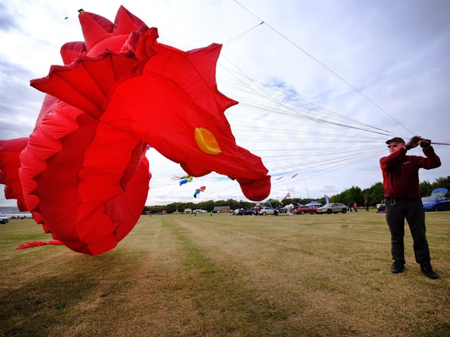 Professional kite flyer Peter Bindon wrangles his kite