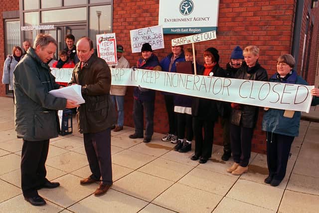 Pictured at the  Environmental Agency HQ, Rotherham, where a petition with 5,000 signatures was handed in to (LEFT) John Housham, agency manager, by John Moran and protesters from Killamarsh in the late 90s.