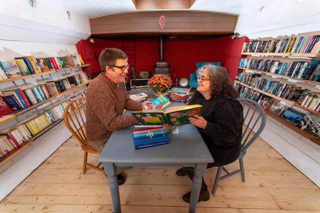 Chris and Victoria Bonner who have converted their barge Marjorie. R. into floating bookshop 'The Hold Fast Bookshop' in Leeds Dock.
28 October 2022.  Picture Bruce Rollinson