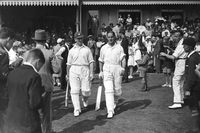 A crowd watching English cricketer Herbert Sutcliffe (right) and his fellow opener, Leyland, go out to bat for Yorkshire against Sussex at Hove.  (Picture: S. R. Gaiger/Topical Press Agency/Getty Images)