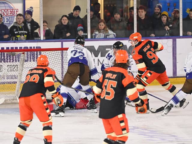 DOUBLE DELIGHT: Mitchell Balmas (far right) scores the first his two goals in Sheffield Steelers' 4-1 win at Manchester Storm on New Year's Day. Picture: Dean Woolley/Steelers Media.