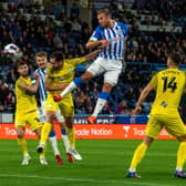 RARE CHANCE: Huddersfield Town's Jordan Rhodes heads at goal but misses the target