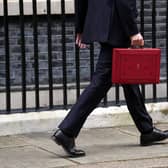 LONDON, ENGLAND - MARCH 15: UK Chancellor Jeremy Hunt leaves Downing Street with the despatch box after presenting his spring budget to parliament on March 15, 2023 in London, England. Highlights of the 2023 budget are an increase in the tax-free allowance for pensions which the Chancellor hopes will stem the number of people taking retirement, a package of help for swimming pools affected by the increase in energy bills and changes to childcare support for parents on universal credit. (Photo by Carl Court/Getty Images)