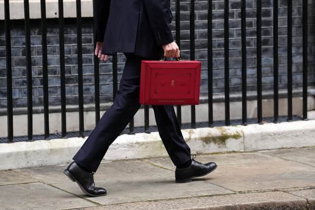 LONDON, ENGLAND - MARCH 15: UK Chancellor Jeremy Hunt leaves Downing Street with the despatch box after presenting his spring budget to parliament on March 15, 2023 in London, England. Highlights of the 2023 budget are an increase in the tax-free allowance for pensions which the Chancellor hopes will stem the number of people taking retirement, a package of help for swimming pools affected by the increase in energy bills and changes to childcare support for parents on universal credit. (Photo by Carl Court/Getty Images)