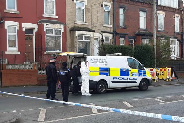 Forensic teams arrive at the scene in Compton Road, Harehills.