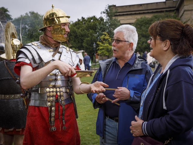 One of the re-enactors speaks to visitors to the Eboracum Roman Festival. Credit: Gareth Buddo