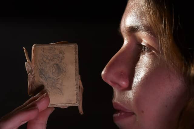 New Exhibition ‘The Brontës and the Wild’, will run throughout 2023 at the Brontë Parsonage Museum in Haworth. Ellen Dando the Visitor Experience Deputy Manager looks at Needle Case with a Birds Nest sketch on by Charlotte Bronte 1829-1832. Picture by Simon Hulme 7th February2023










