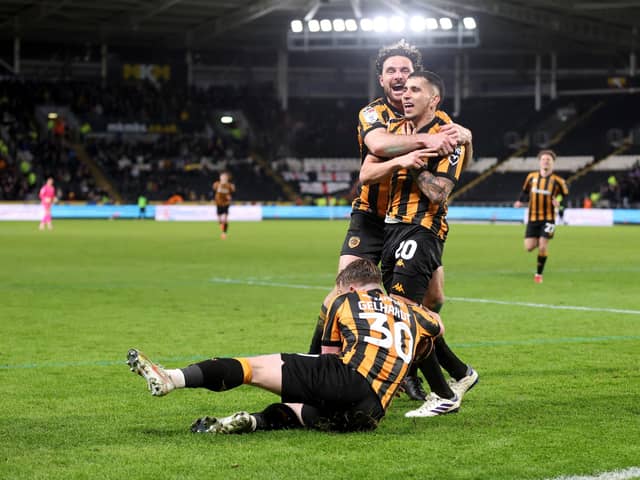 Gustavo Puerta of Hull City celebrates scoring his team's winner against Oxford with team-mates Lewis Coyle and Joe Gelhardt (Picture: George Wood/Getty Images)