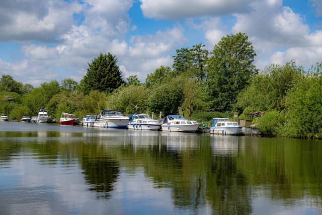 Boats moored on the River Ouse at Naburn between York and Selby in North Yorkshire, photographed by Tony Johnson for The Yorkshire Post.  25th May 2023