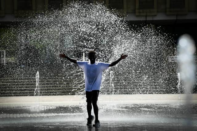 Cooling down in the fountains in Bradford. Image: Simon Hulme