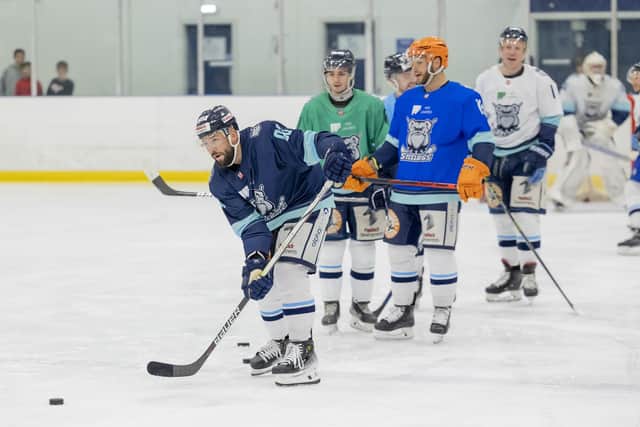 LEADING MAN: Jason Hewitt (left) was confirmed as player-coach for the Sheffield Steeldogs, while former Steeldogs' players Liam Kirk (second left) and Robert Dowd (third left) got on the ice to show their support for the team. Picture courtesy of Peter Best/Steeldogs Media.