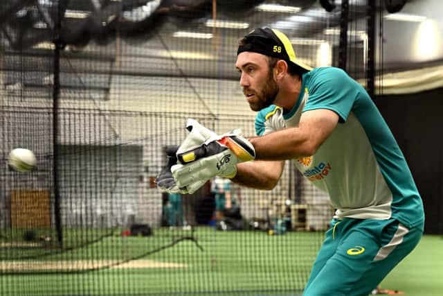 Glenn Maxwell, the former Yorkshire all-rounder, practises with the wicketkeeping gloves ahead of Friday's match at the MCG as Australia prepare to take on England. Photo by William West/AFP via Getty Images).