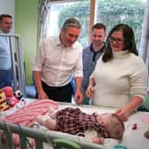Sir Keir Starmer and shadow health secretary Wes Streeting meet Michael and Kelly with their daughter Sienna Miler-Baron during a visit to Alder Hey Children's Hospital, Liverpool, to unveil their Child Health Action Plan.