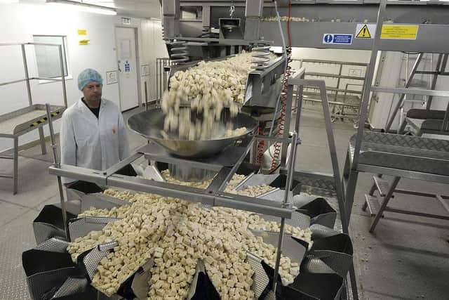 Meat-free Quorn pieces, manufactured by Quorn Foods, fall from the production line into a sorting machine ahead of packaging at the company's factory in Stokesley, U.K. Picture: Nigel Roddis/Bloomberg