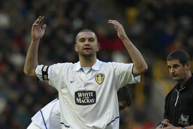 WOLVERHAMPTON, ENGLAND - DECEMBER 28:  Dominic Matteo of Leeds recieves a yellow card during the FA Barclaycard Premiership match between Wolverhampton Wanderers and Leeds United at Molineux on December 28, 2003 in Wolverhampton, England.  (Photo by Jamie McDonald/Getty Images)