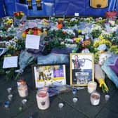 Lit candles among the flowers and messages left in tribute to Nottingham Panthers' ice hockey player Adam Johnson outside the Motorpoint Arena in Nottingham, the home of the Panthers.(Picture: Jacob King/PA Wire)