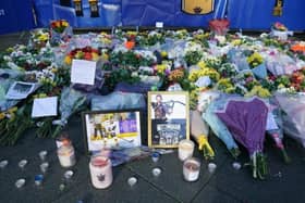 Lit candles among the flowers and messages left in tribute to Nottingham Panthers' ice hockey player Adam Johnson outside the Motorpoint Arena in Nottingham, the home of the Panthers.(Picture: Jacob King/PA Wire)