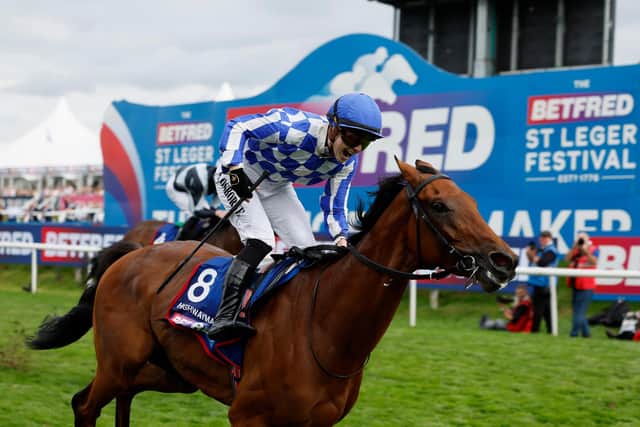 Highwayman ridden by Saffie Osborne on their way to winning the Betfred St Leger Stakes on day three of the Betfred St Leger Festival at Doncaster Racecourse.