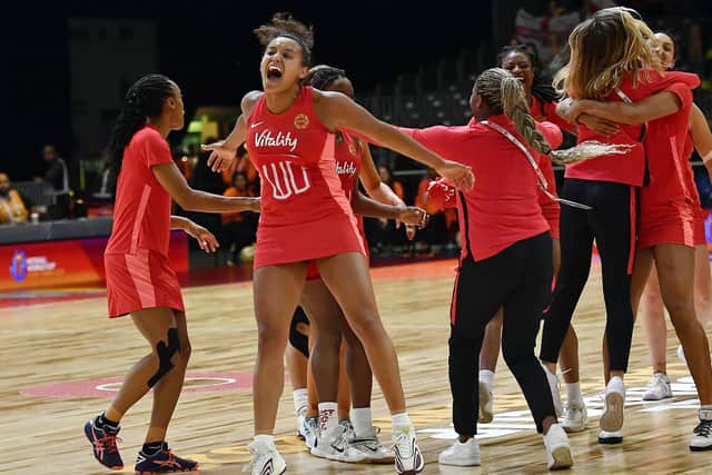 Contender: Huddersfield's Imogen Allison, centre, leads her England team-mates in celebration after they beat Australia in the pool stage of the Netball World Cup en route to a historic first ever final. (Picture: Getty Images)