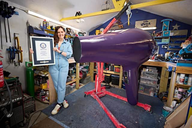 Ruth Amos with the world's largest hairdryer. Photo: Paul Michael Hughes/Guinness World Records