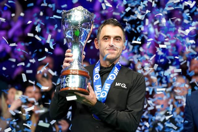 Ronnie O'Sullivan celebrates with the trophy after winning the final against Ding Junhui at the 2023 MrQ UK Championship at the York Barbican. Photo: Mike Egerton/PA Wire.