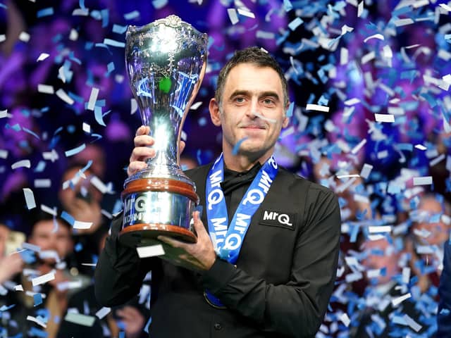 Ronnie O'Sullivan celebrates with the trophy after winning the final against Ding Junhui at the 2023 MrQ UK Championship at the York Barbican. Photo: Mike Egerton/PA Wire.