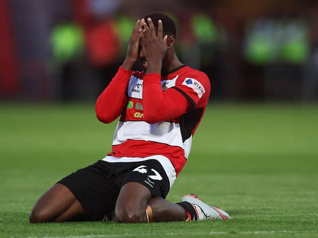 DESPAIR: Doncaster Rovers forward Hakeeb Adelakun reacts to a miss during the League Two play-off semi-final second leg against Crewe Alexandra. His decisive penalty would be saved in the shoot-out