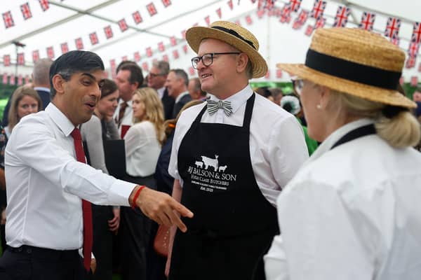 Prime Minister Rishi Sunak speaks with butchers as he tours stalls in the garden of Downing Street, London, during the second Farm to Fork summit. PIC: Toby Melville/PA Wire