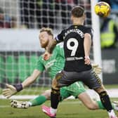 NOT THIS TIME: Rotherham United goalkeeper Viktor Johansson stops Southampton's Adam Armstrong from scoring at the Aesseal New York Stadium on Saturday. Picture: Richard Sellers/PA