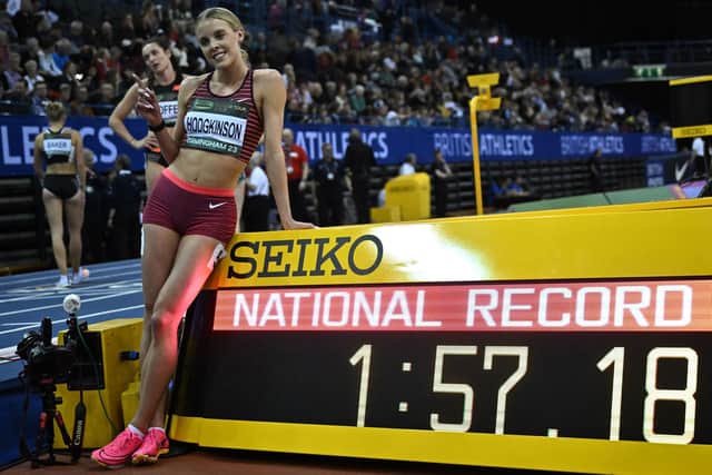 In form: Britain's Keely Hodgkinson poses next to the time for her women's 800m win, a new British record, on Saturday (Picture: BEN STANSALL/AFP via Getty Images)