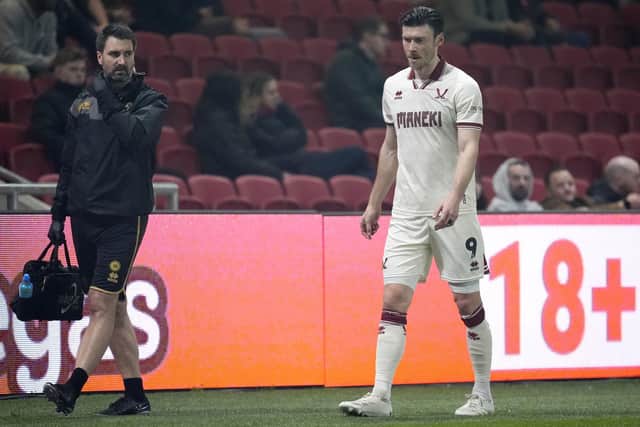 DOUBTFUL: Sheffield United's Kieffer Moore (right) leaves the pitch after picking up an injury at Ashton Gate on Tuesday in the 2-1 win over Bristol City. Picture: Nick Potts/PA