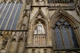 The statue sits above York Minster's Great West Door