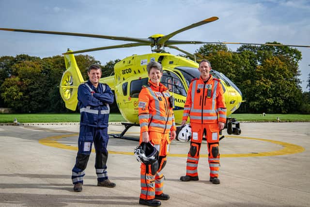 Yorkshire Air Ambulance pilot Garry Brasher with paramedic  Sammy Wills and Dr Steve Rowe at their base in Nostell near Wakefield