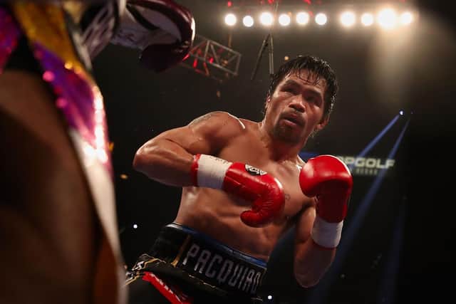Manny Pacquiao fights Adrien Broner during the WBA welterweight championship. (Pic credit: Christian Petersen / Getty Images)
