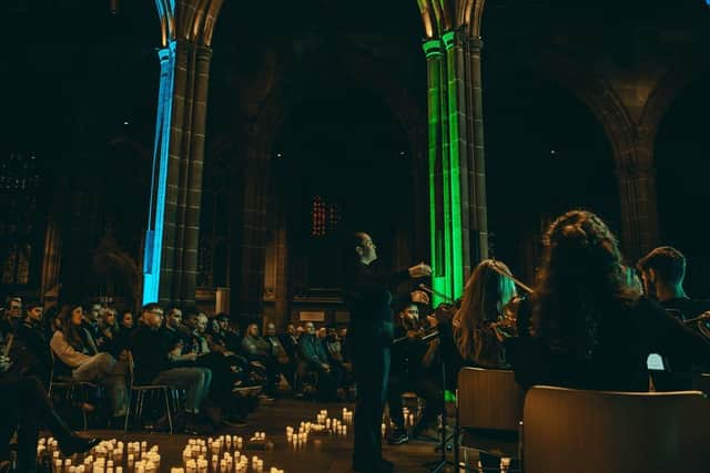 Paradox Orchestra performing to a pack cathedral audience