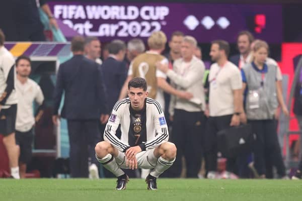 NIGHTMARE: Kai Havertz contemplates Germany's World Cup elimination as coach Danny Rohl looks on in the background (left)