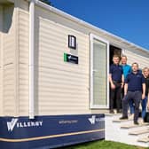 Willerby chief executive Peter Munk, right, with some of the team behind the development of Willerby All-E outside a Brookwood holiday home, featuring the all-electric specification. Picture: Shaun Flannery Photography