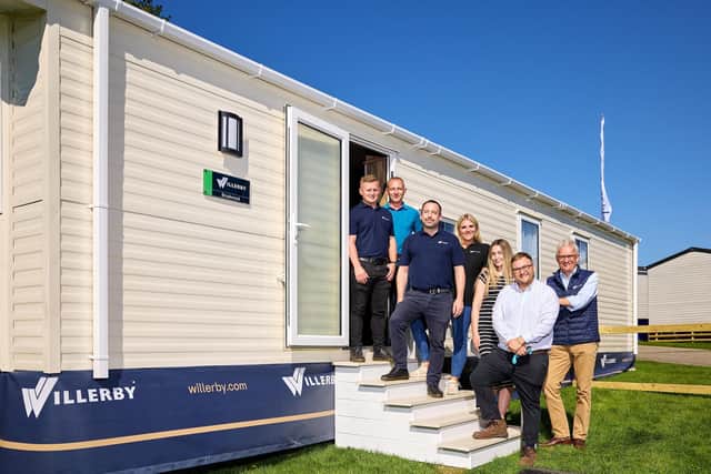 Willerby chief executive Peter Munk, right, with some of the team behind the development of Willerby All-E outside a Brookwood holiday home, featuring the all-electric specification. Picture: Shaun Flannery Photography
