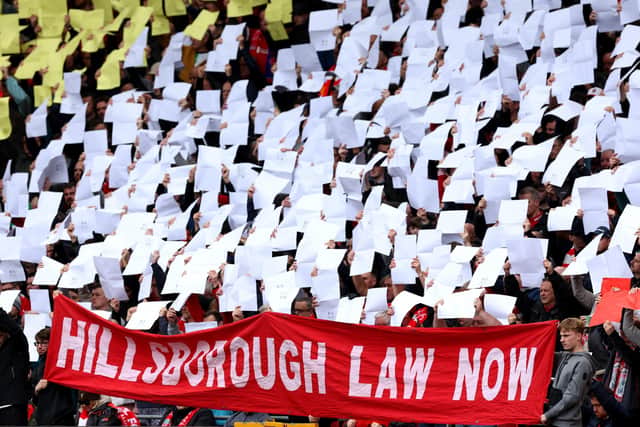 Fans hold up their mosaics to mark the 35th Anniversary of Hillsborough and a banner reading 'Hillsborough Law Now' is seen prior to the Premier League match between Liverpool FC and Crystal Palace at Anfield in 2024. Picture by Michael Steele/Getty Images.