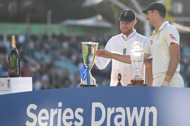 England captain Ben Stokes and Australia captain Pat Cummins with the shared Ashes trophies after day five of the LV= Insurance Ashes 5th Test Match (Picture: Stu Forster/Getty Images)