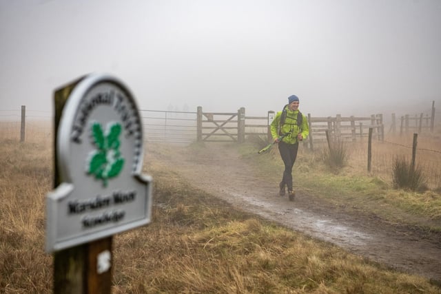 Runners endured difficult conditions on Saturday, with rain and fog
