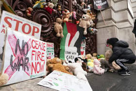 Parents and children lay out cuddly toys across the entrance to the Foreign Office in London, as they protest to save children's lives in Gaza. PIC: Jordan Pettitt/PA Wire