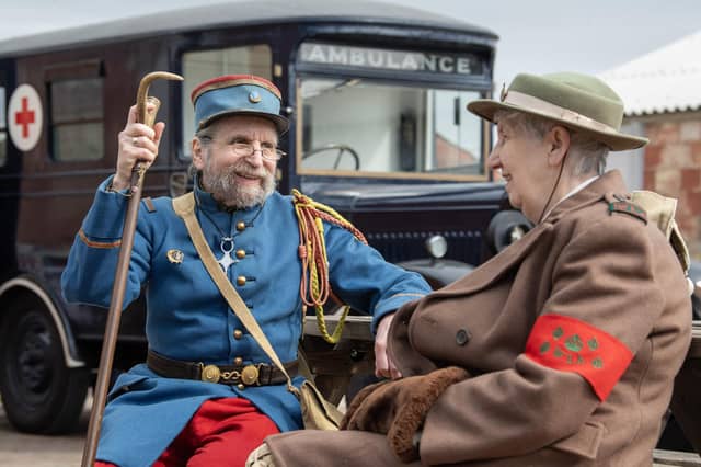 Re-enactors David Farrance dressed in a 1937 French 21st Tirailleurs uniform with Pauline North representing the women's land army.