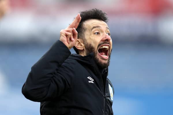 Carlos Corberan, manager of Huddersfield Town, reacts during the Sky Bet Championship match between Huddersfield Town and Swansea City at John Smith's Stadium on February 20, 2021.