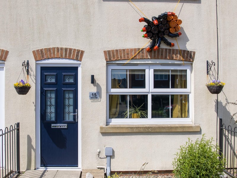 A giant spider adorns a home for Flamborough Flowerpot Festival 2026