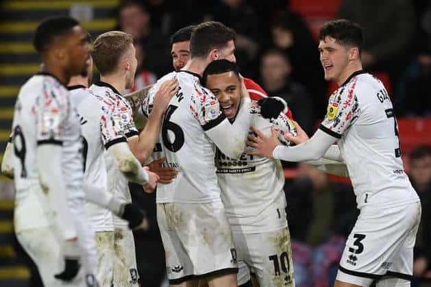 SHEFFIELD, ENGLAND - FEBRUARY 15: Cameron Archer (2R) of Middlesbrough celebrates with teammates after scoring the team's third goal during the Sky Bet Championship between Sheffield United and Middlesbrough at Bramall Lane on February 15, 2023 in Sheffield, England. (Photo by Michael Regan/Getty Images)