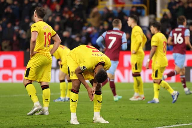 DEVASTATED: Auston Trusty of Sheffield United looks dejected after Luca Koleosho of Burnley (not pictured) scores his team's fourth goal