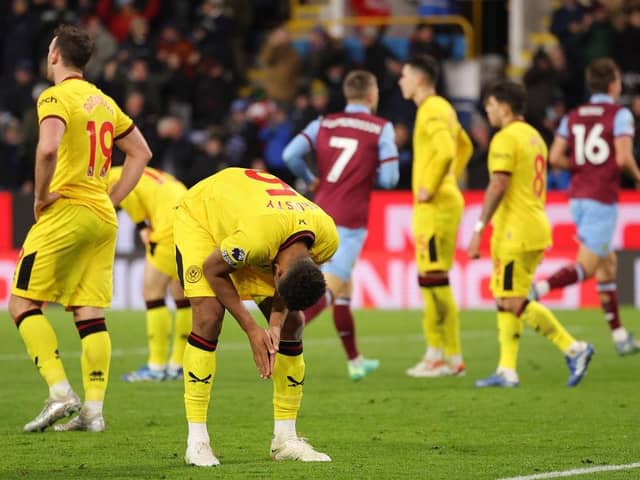 DEVASTATED: Auston Trusty of Sheffield United looks dejected after Luca Koleosho of Burnley (not pictured) scores his team's fourth goal